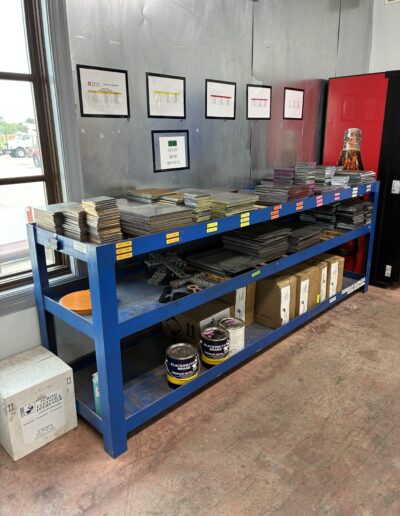 small squares of plate, targets, and metal plate on shelf
