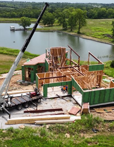 aerial view of boom truck and house construction