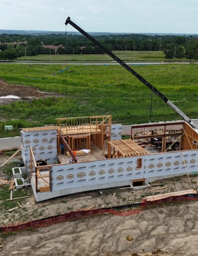 aerial view of boom truck at homebuilding site