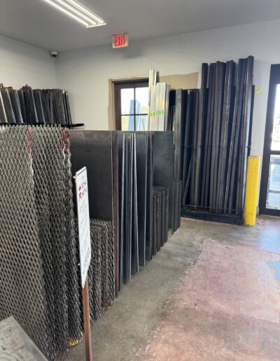 plate, tubing, and angle on racks in the retail showroom